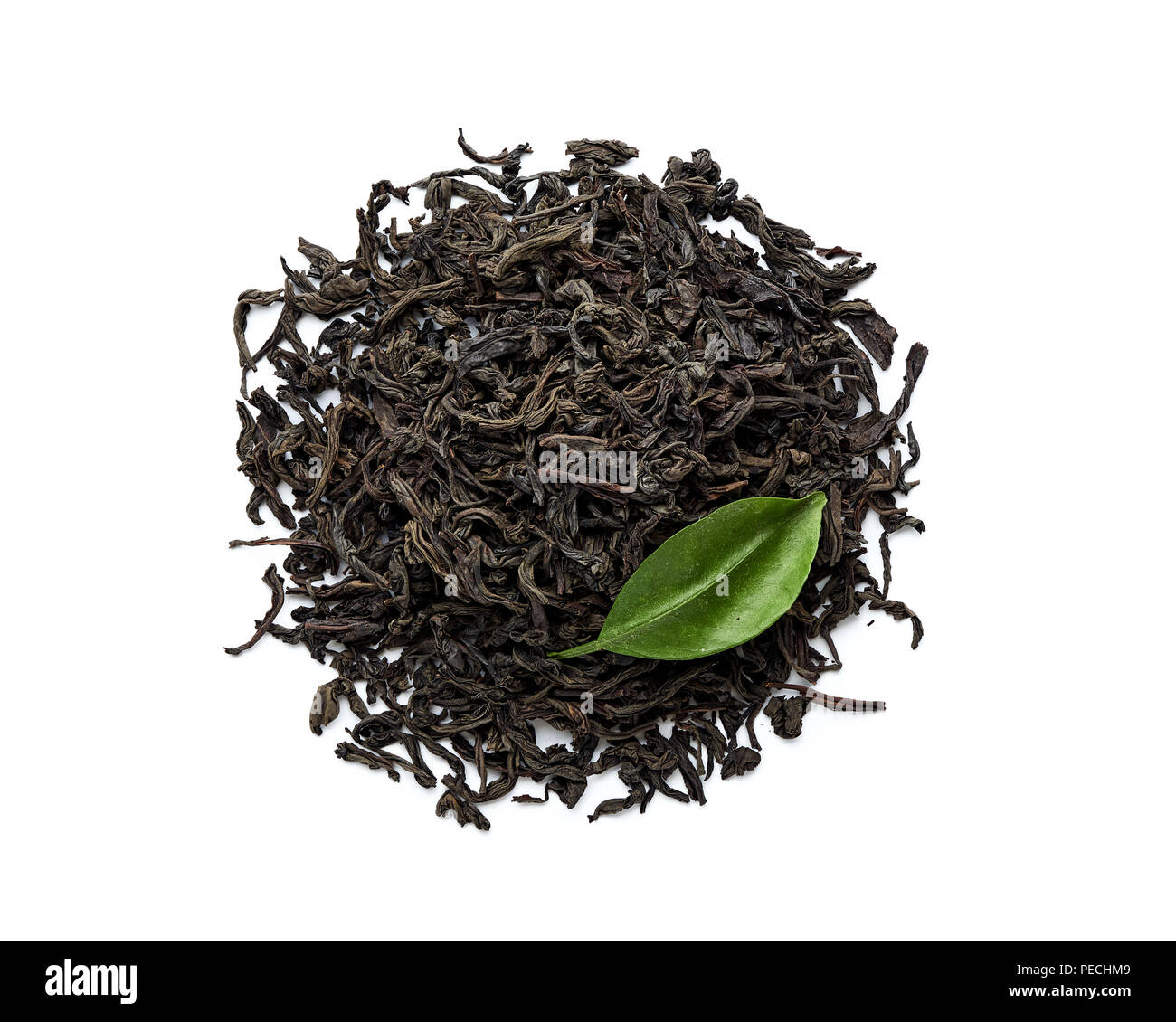 Dried black tea leaves isolated on white background. Top view Stock