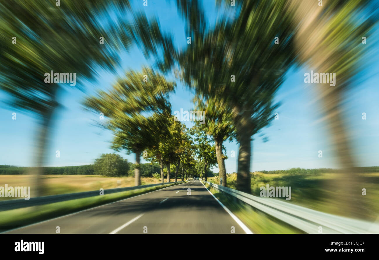 driving fast concept -  motion blur on rural highway Stock Photo