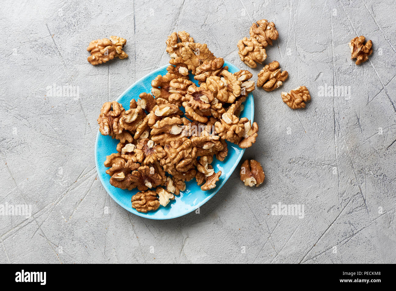 Walnut kernels on gray background. Stock Photo
