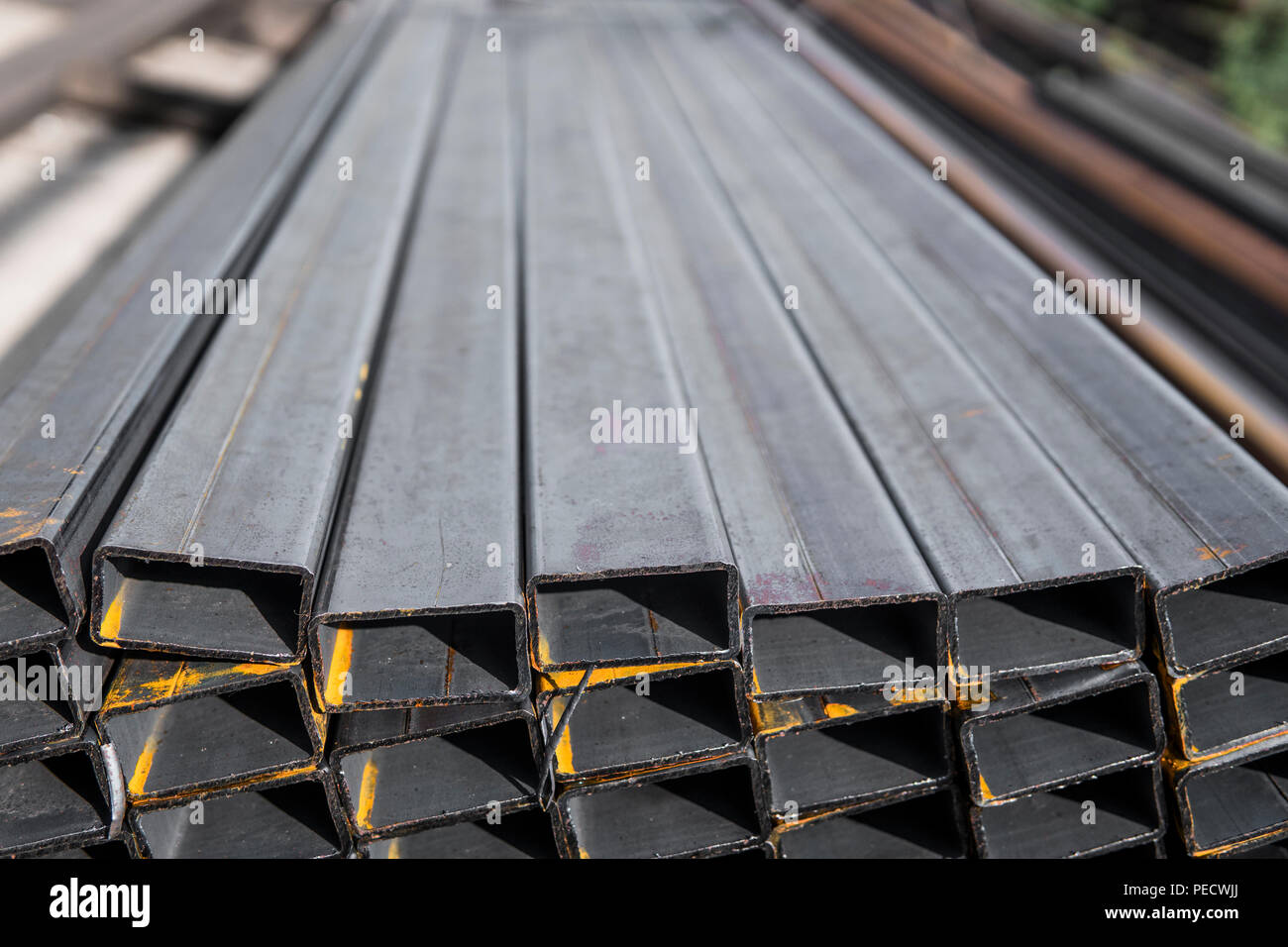 Square flatrolled pipe metal profile in packs at the warehouse of