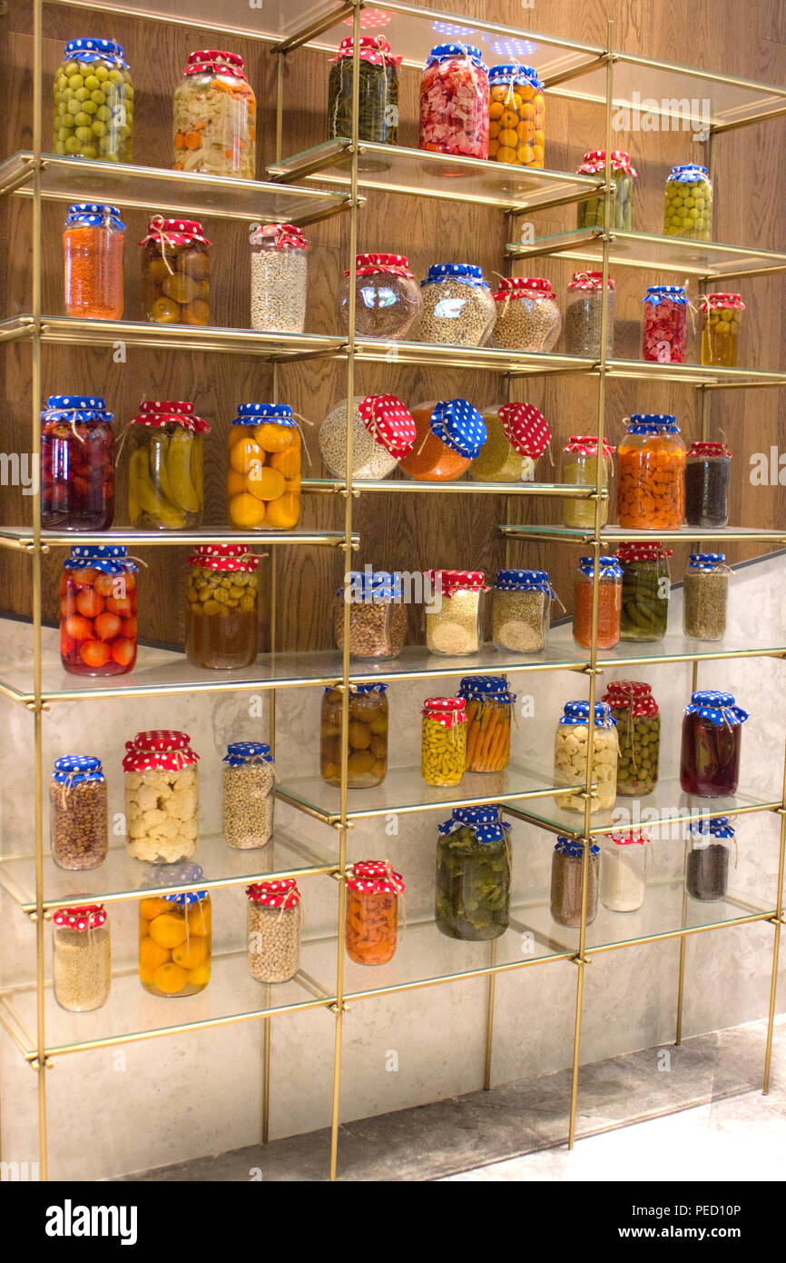Canned fruits and vegetables, cans with cereals on shelf Stock Photo