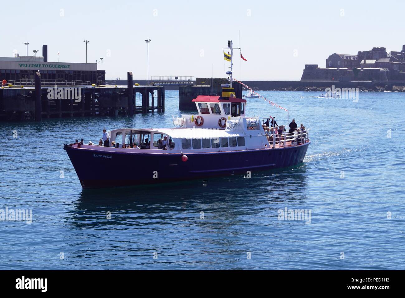 Passenger ferry Sark Belle arrives at St Peter Port, Guernsey Stock Photo