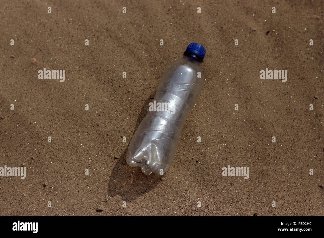 plastic bottle in the sand Stock Photo Alamy