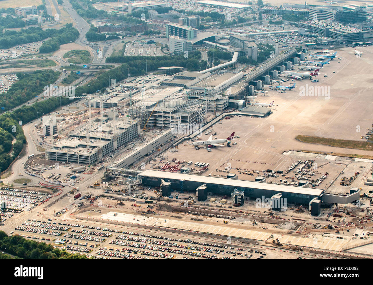 Manchester Airport aerial photo over new terminal construction project