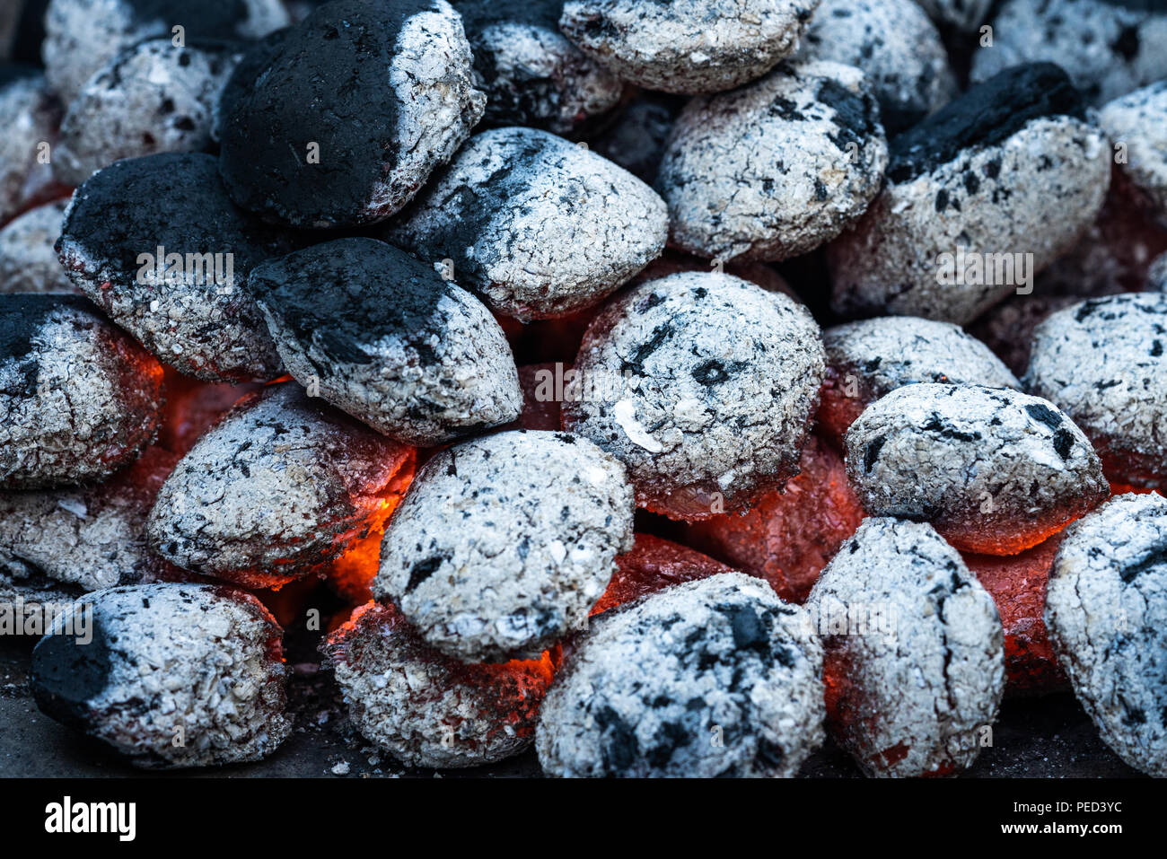 Charcoal is burning on a charcoal grill for barbeque. Stock Photo