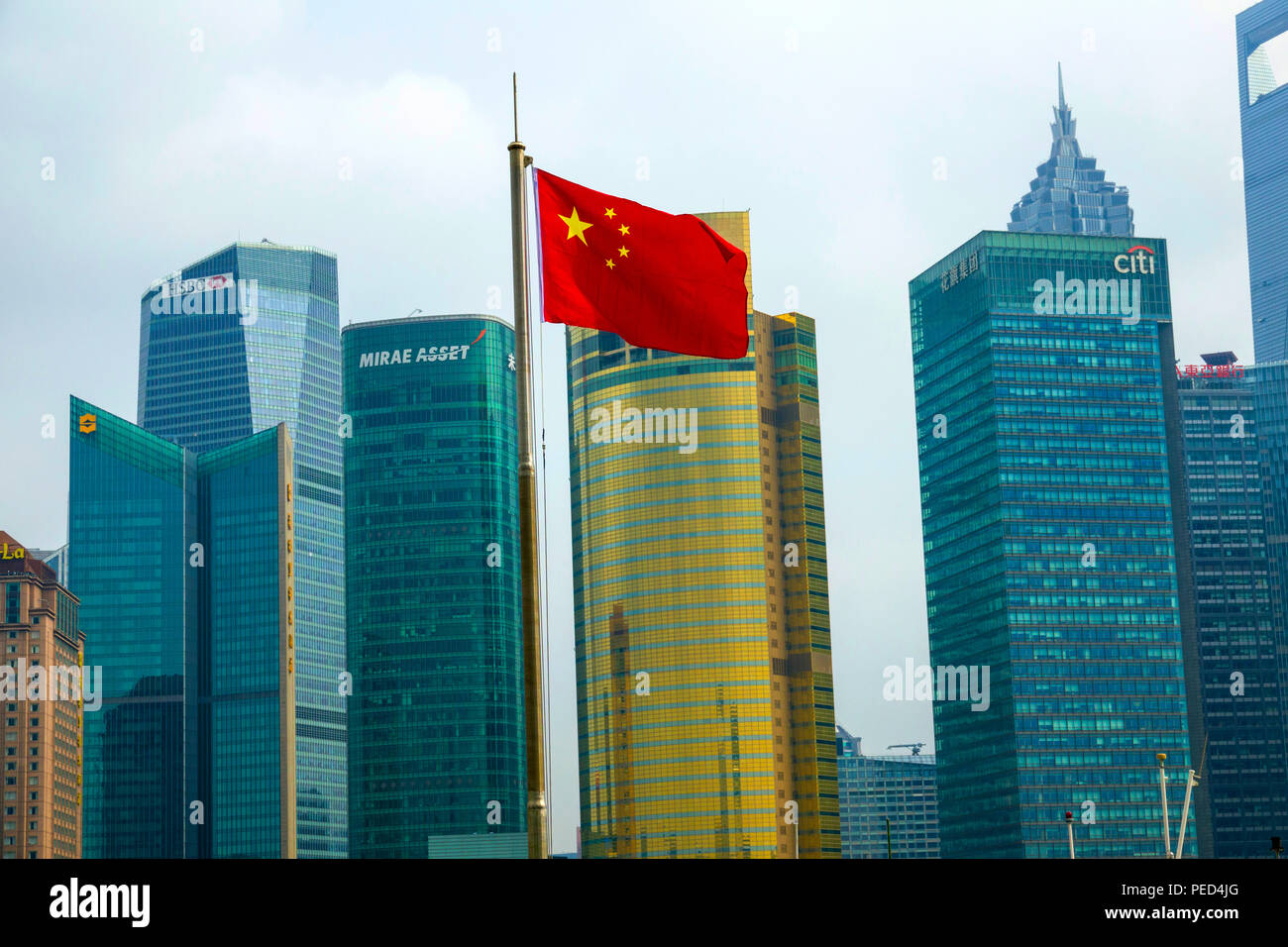 Flag of People's Republic of China in Shanghai Communist Party with Skyline in background Stock Photo