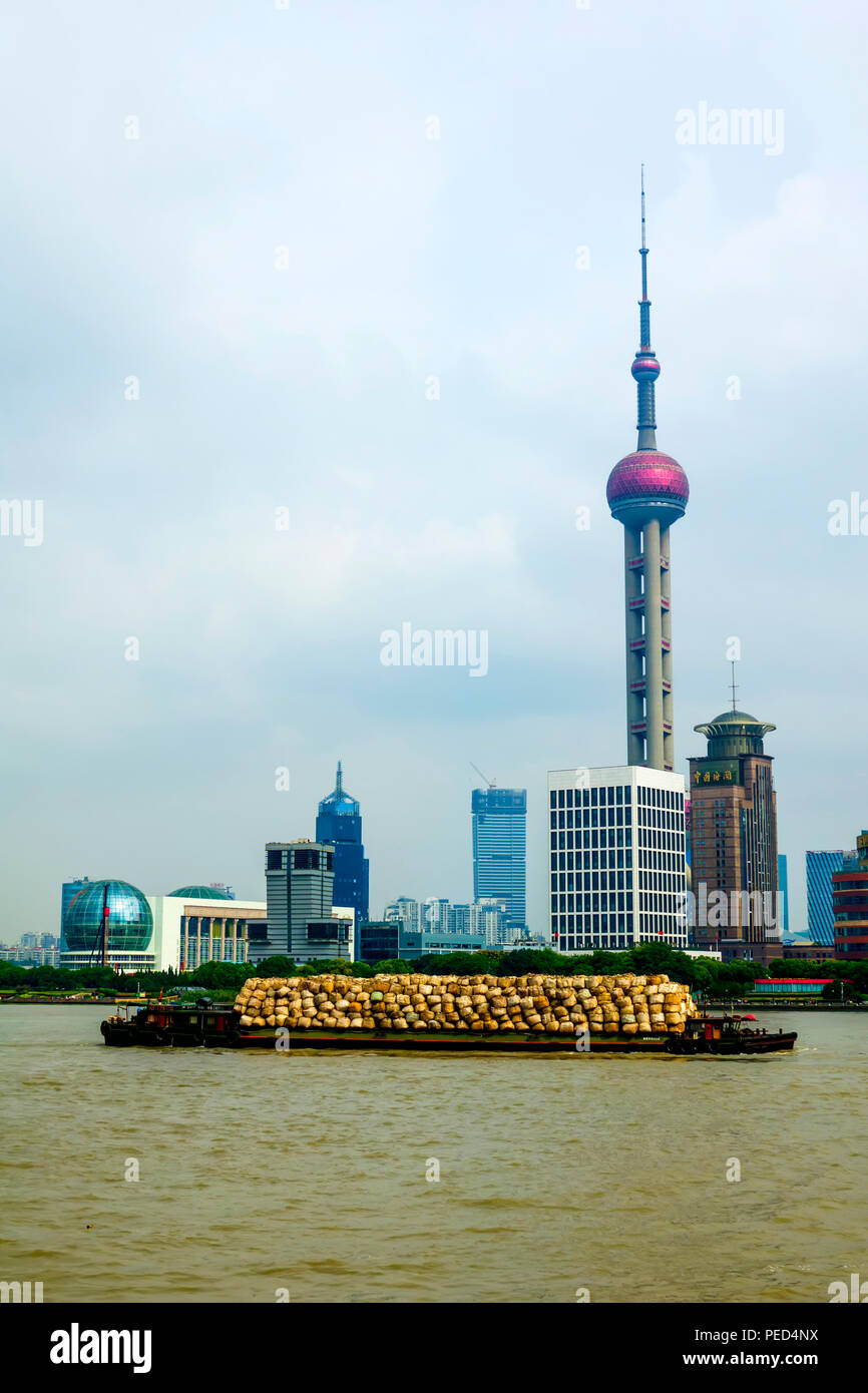 Shanghai Skyline on the Bund with trash barge Yangtze River China Asia Stock Photo