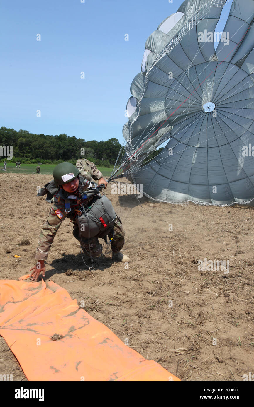 U.S. Army Staff Sgt. Sherwein Asuncion dives for the 'X' on the drop zone during Leapfest 2015 in West Kingston, R.I., Aug. 1, 2015. Leapfest is an International parachute competition hosted by the 56th Troop Command, Rhode Island National Guard to promote high level technical training and esprit de corps within the International Airborne community. (U.S. Army Photo by Spc. Joseph Cathey/ Released) Stock Photo