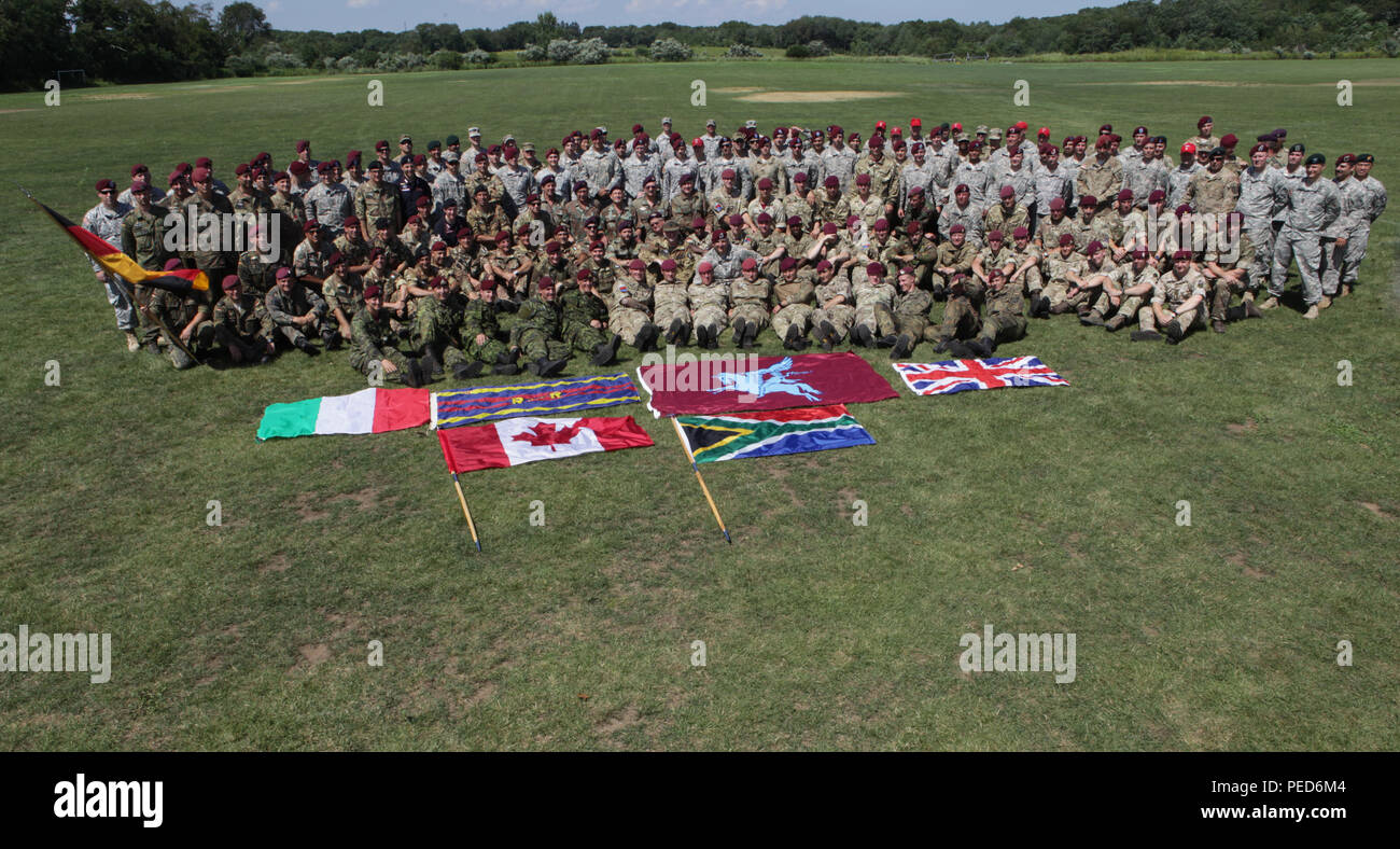 All the paratroopers that received foreign wings pose for a photo in West Kingston, R.I. during the closing of Leapfest, Aug. 3, 2015.  Leapfest is an International parachute competition hosted by the 56th Troop Command, Rhode Island National Guard to promote high level technical training and esprit de corps within the International Airborne community. (U.S. Army Photo by Sgt. 1st Class Horace Murray/Released) Stock Photo