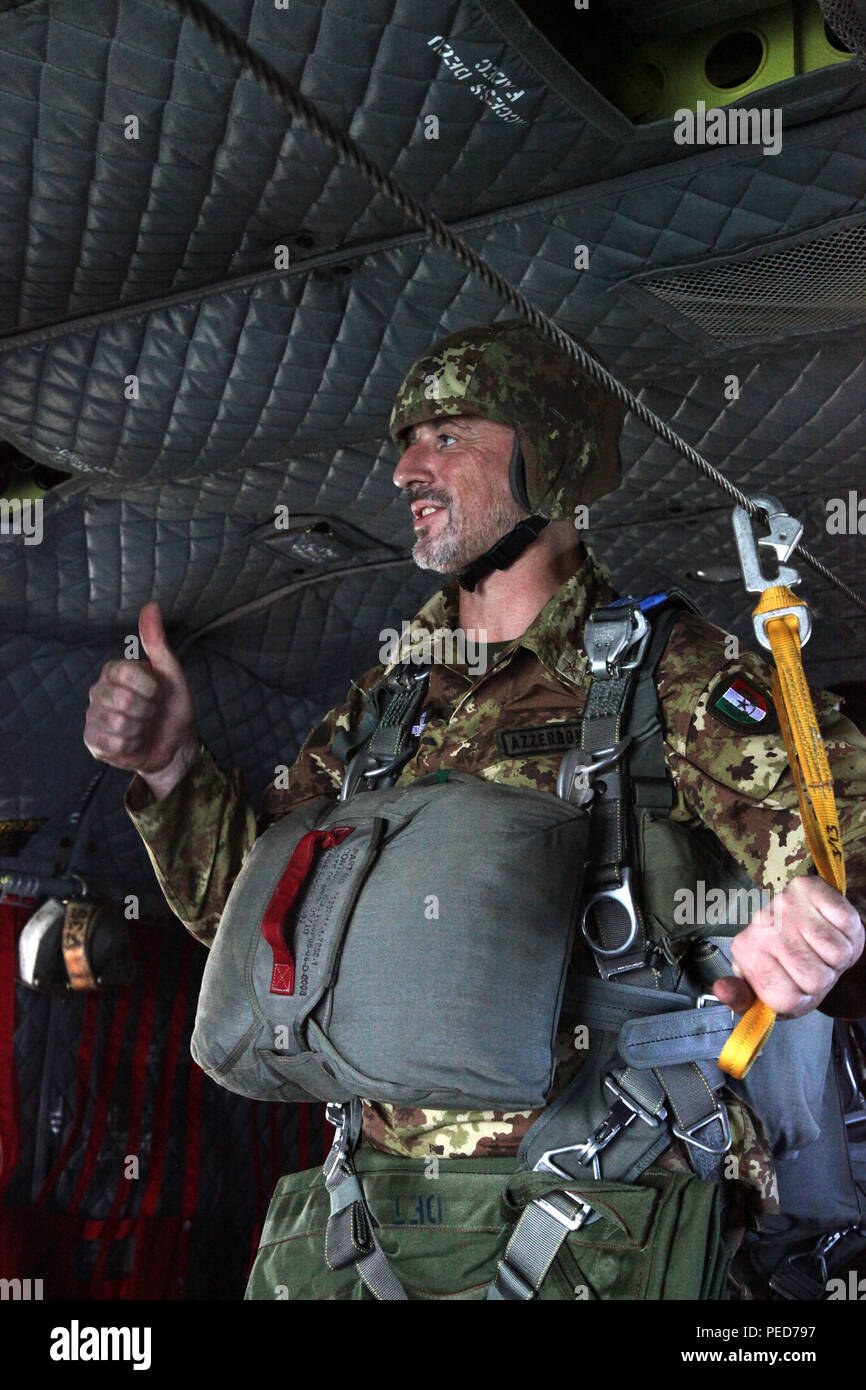 Italian paratrooper Luigi Azzerboni gives a thumbs up to the jumpmaster prior to the wing exchange jump at Leapfest in West Kingston, R.I., Aug. 3, 2015. Leapfest is an International parachute competition hosted by the 56th Troop Command, Rhode Island National Guard to promote high level technical training and esprit de corps within the International Airborne community. (U.S. Army Photo by Spc. Josephine Carlson/Released) Stock Photo