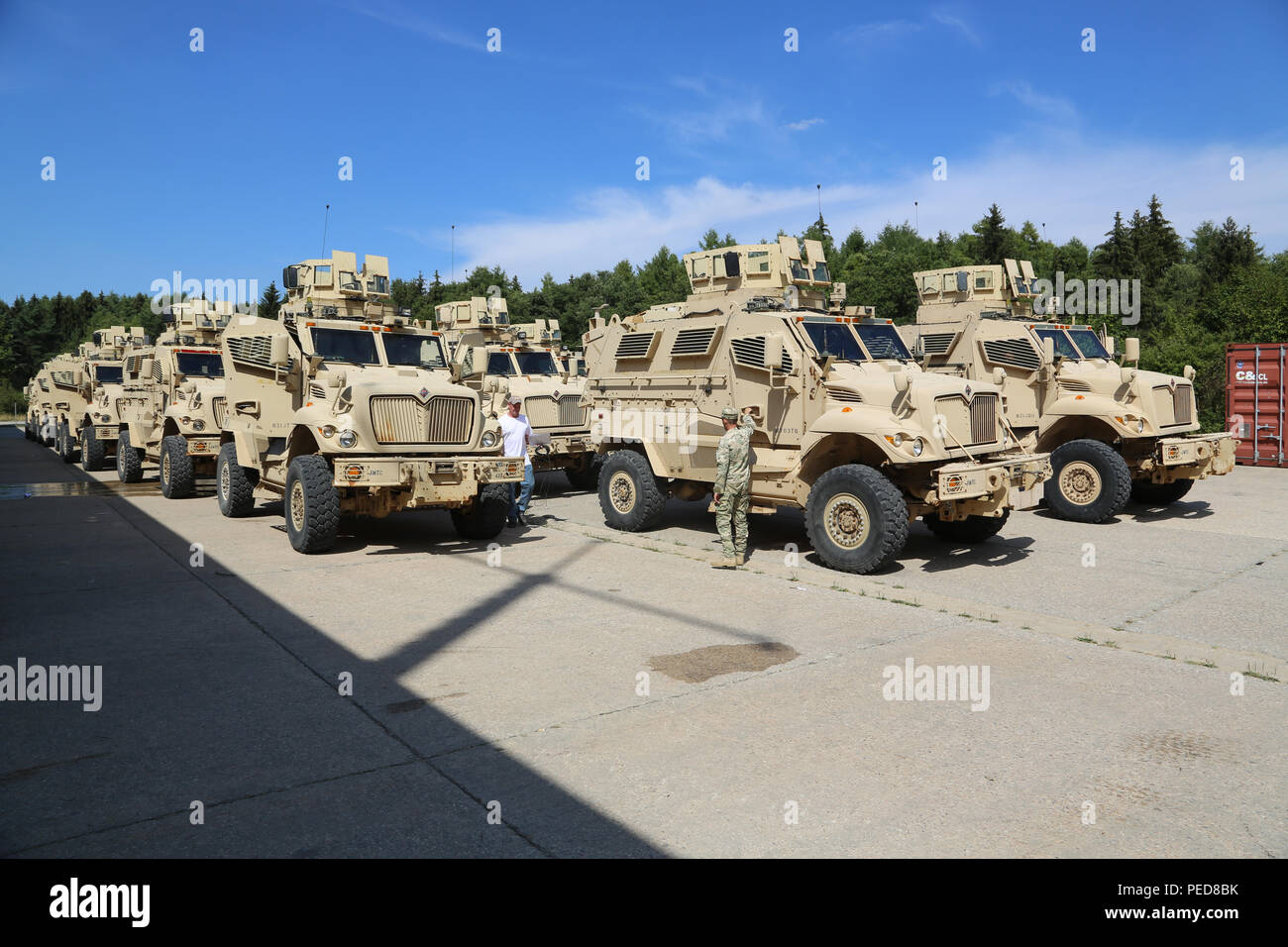 Multi Integrated Laser Engagement System (MILES) specialists inventory MaxxPro Mine-Resistant, Ambush Protected Vehicles during a mission rehearsal exercise (MRE) at the Joint Multinational Readiness Center in Hohenfels, Germany, Aug. 4, 2015.  Georgian soldiers conduct the MRE alongside U.S. Marine Corps mentors before deploying to Afghanistan in order to hone the skills necessary to operate alongside International Security Assistance Force partner forces in a counterinsurgency environment. (U.S. Army photo by Spc. Tyler Kingsbury/Released) Stock Photo
