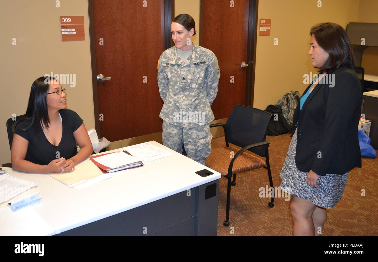 The Honorable Debra S. Wada, Assistant Secretary of the Army, Manpower & Reserve Affairs (right), speaks to Reelana Gonzales, 314th Combat Sustainment Support Battalion, staff operations training specialist, Sgt. Talena Baker, 314th CSSB human resource specialist during her visited to the George W. Dunaway Army Reserve Center, in Sloan, Nev., Aug. 7. Stock Photo