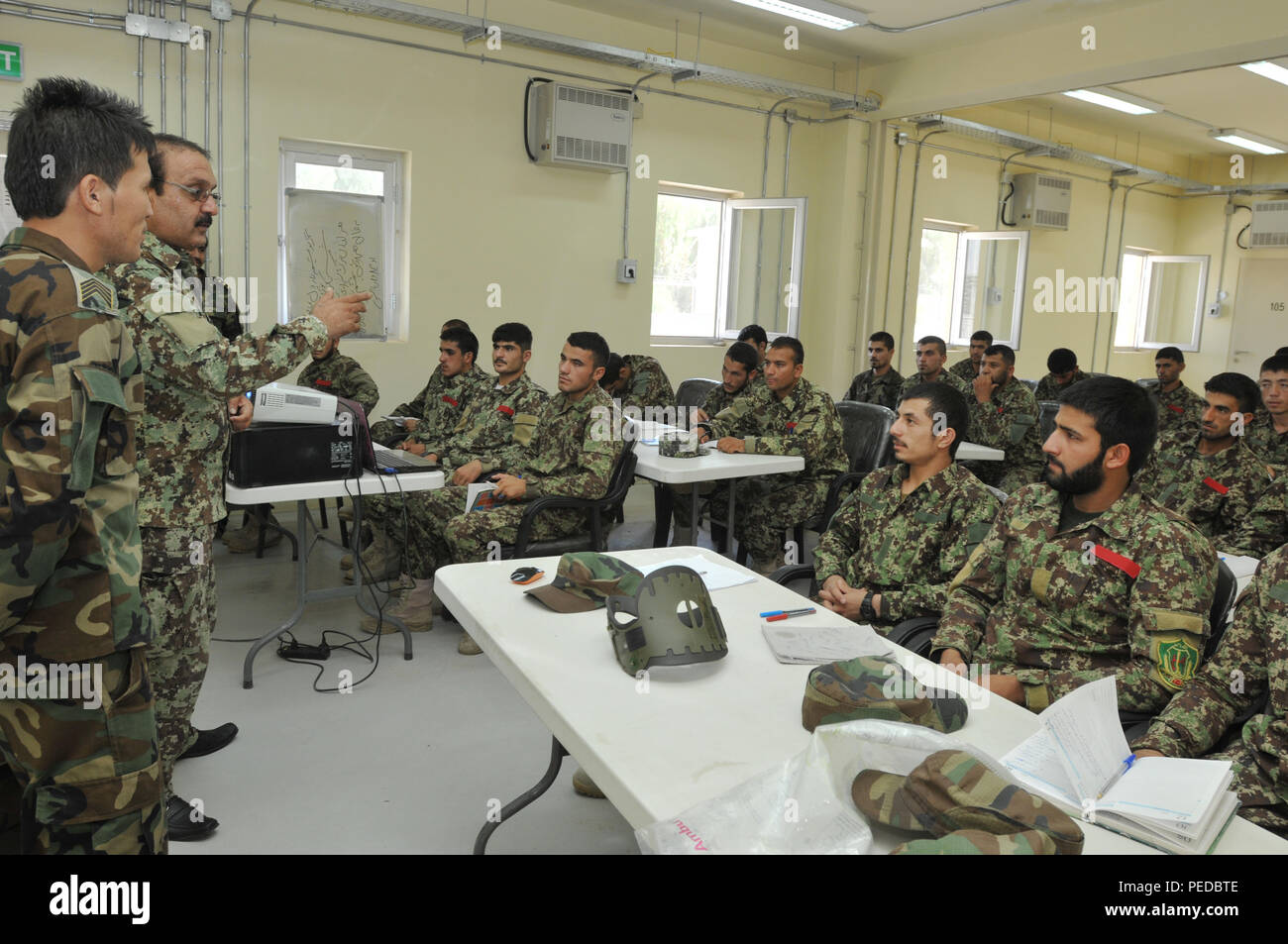 KANDAHAR, Afghanistan (Aug. 8, 2015) Afghan National Army 205th Corps Maj. Nisar Ahmad, commander of Kandahar Regional Military Hospital medical training facilities located at Camp Hero, Afghanistan, addresses new physician assistant students during a class. The Afghan-led training provides a solid foundation to successfully work at KRMH, the most capable Afghan medical facility within Kandahar and Helmand provinces. The ANA works closely with coalition advisors from Train, Advise and Assist Command - South to advance their capabilities to provide premium care for Afghan security forces as par Stock Photo