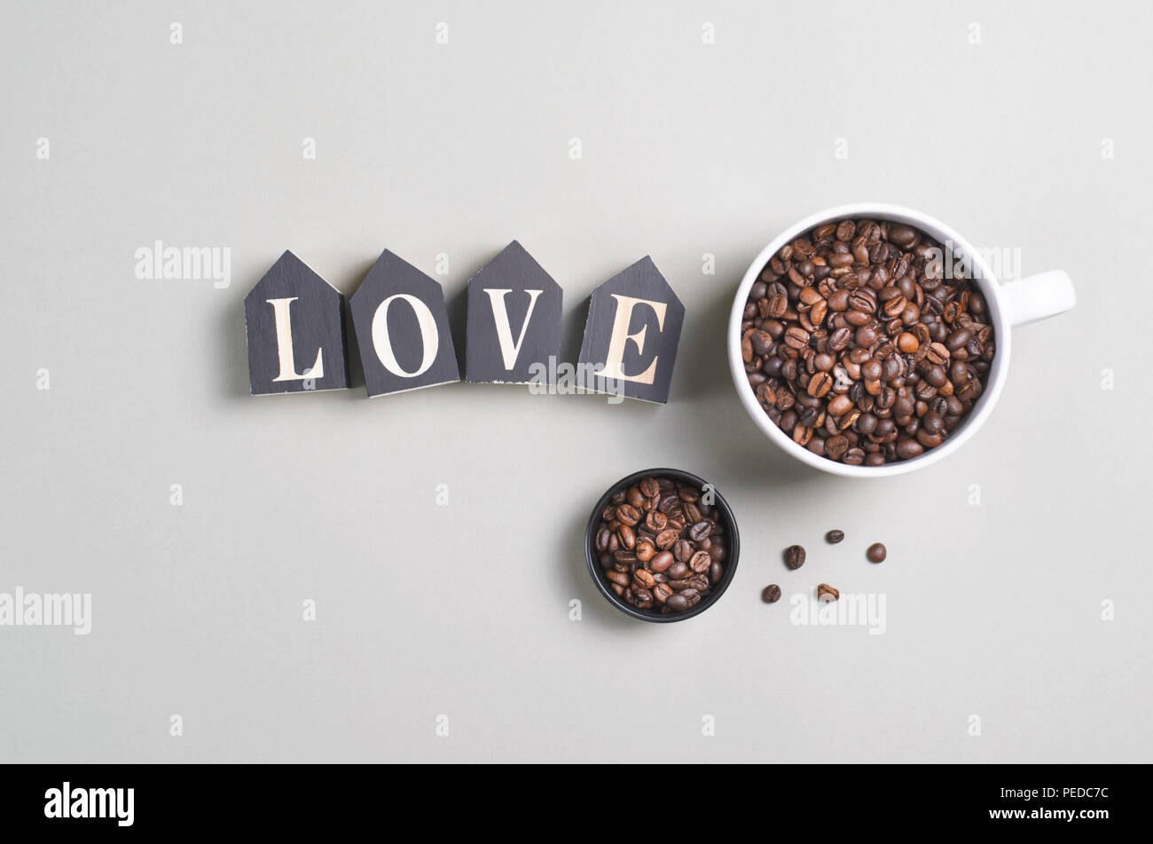Cup of Coffee Beans on Bright Beige Background, Coffee Mug, Love Cozy Concept Stock Photo