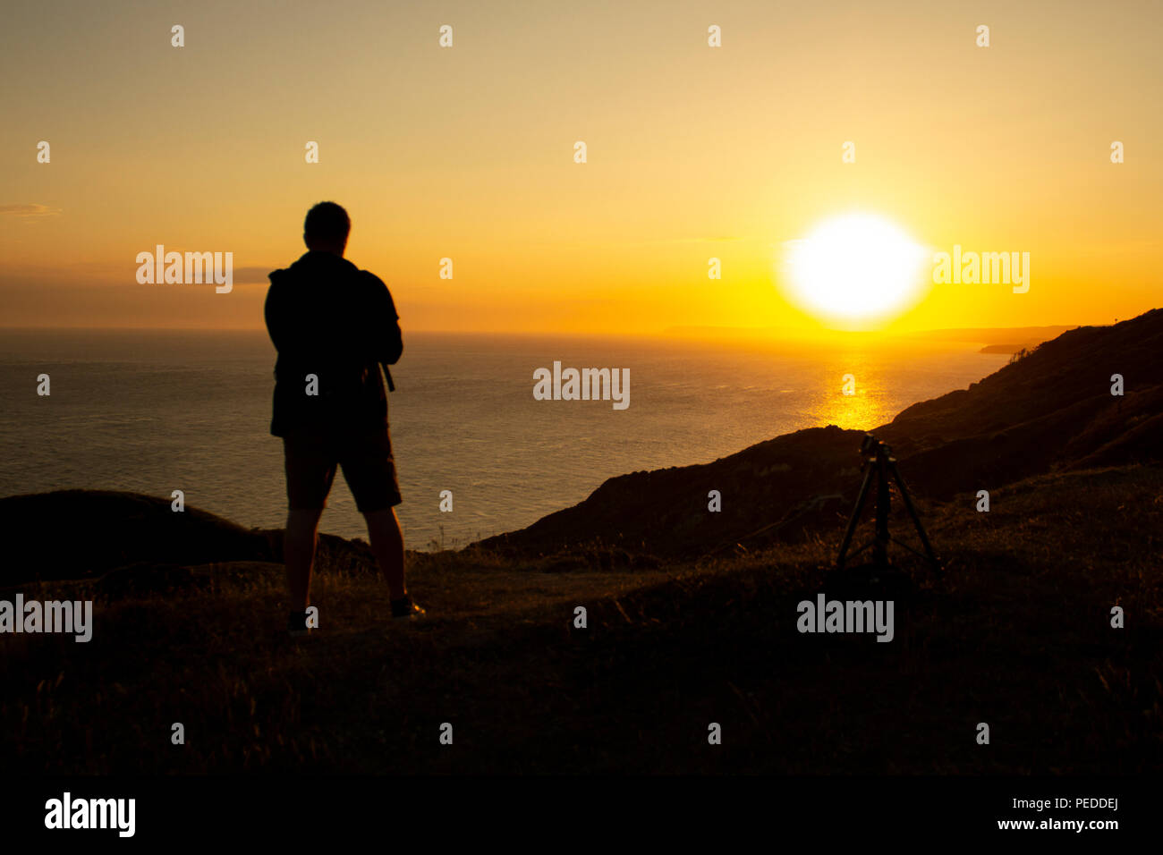 Silhouette against the sun, Deep in thought Stock Photo