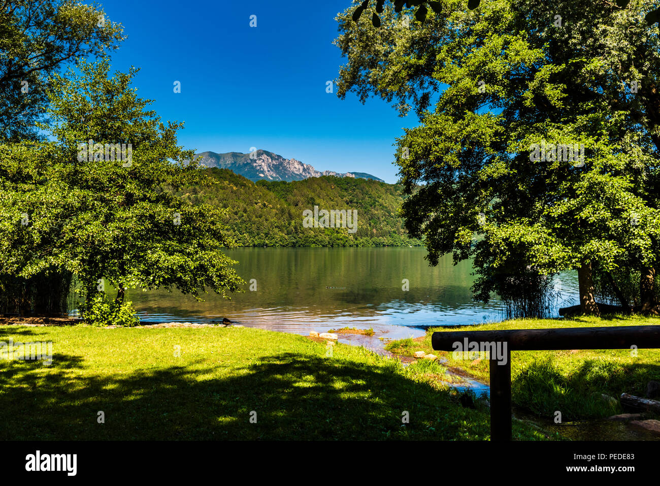 Lake and mountains at Levico Terme, Trentino, Italy Stock Photo