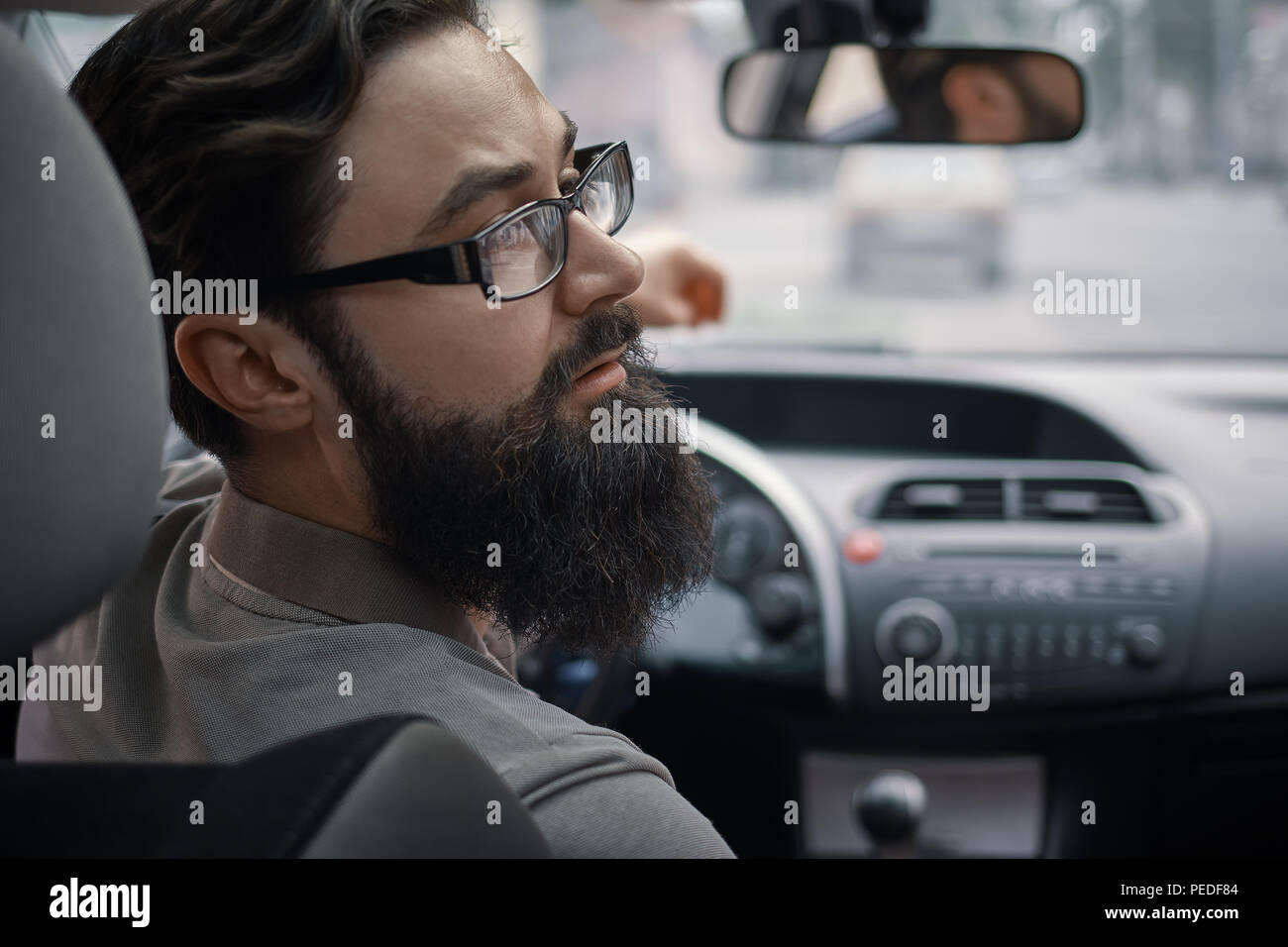 Driver man paying attention to road Stock Photo