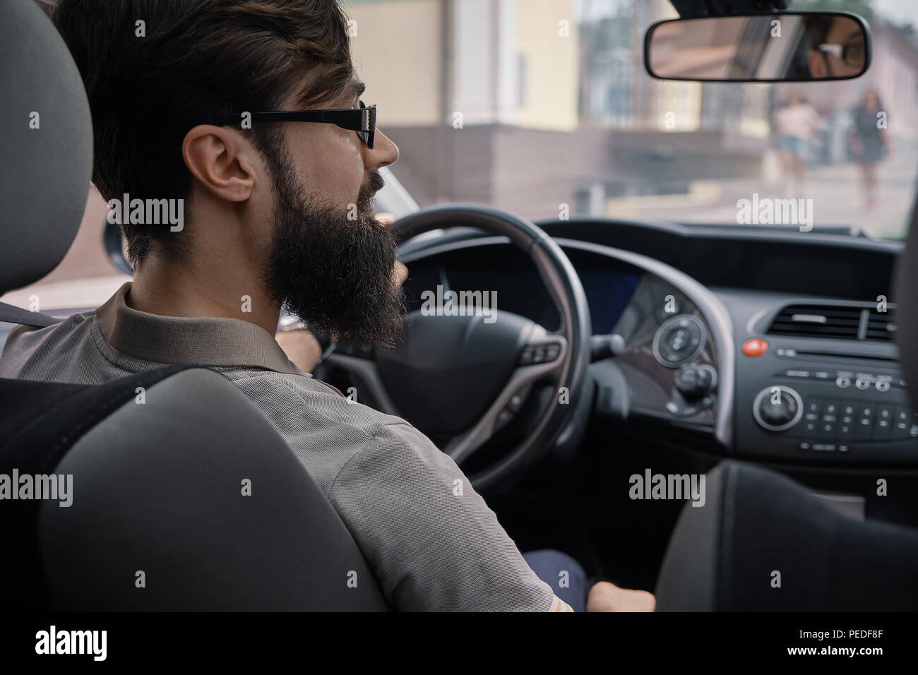 Driver man paying attention to road Stock Photo