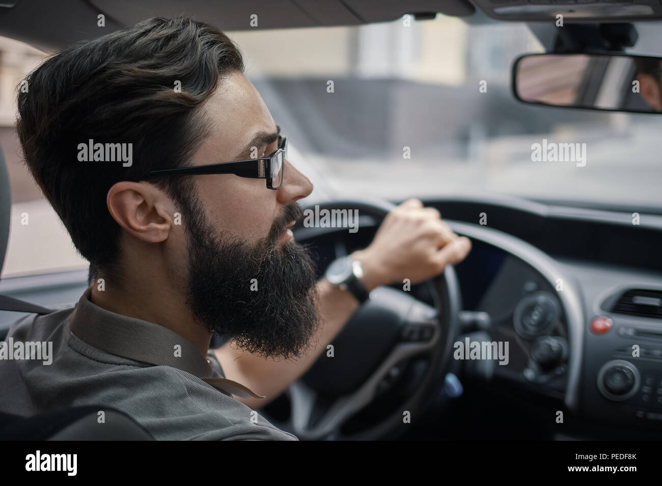 Driver man paying attention to road Stock Photo