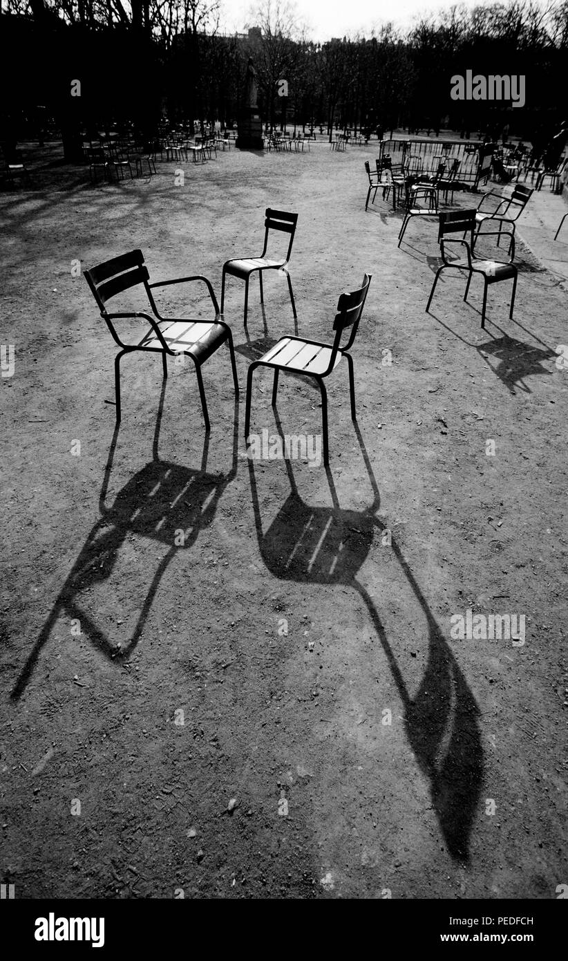 Paris France. Chairs in the Jardin du Luxembourg. 2000 The Jardin du Luxembourg, also known in English as the Luxembourg Gardens, is located in the 6th arrondissement of Paris, France. It was created beginning in 1612 by Marie de' Medici, the widow of King Henry IV of France, for a new residence she constructed, the Luxembourg Palace. The garden today is owned by the French Senate, which meets in the Palace. It covers 23 hectares and is known for its lawns, tree-lined promenades, flowerbeds, model sailboats on its circular basin, and picturesque Medici Fountain, built in 1620. Stock Photo