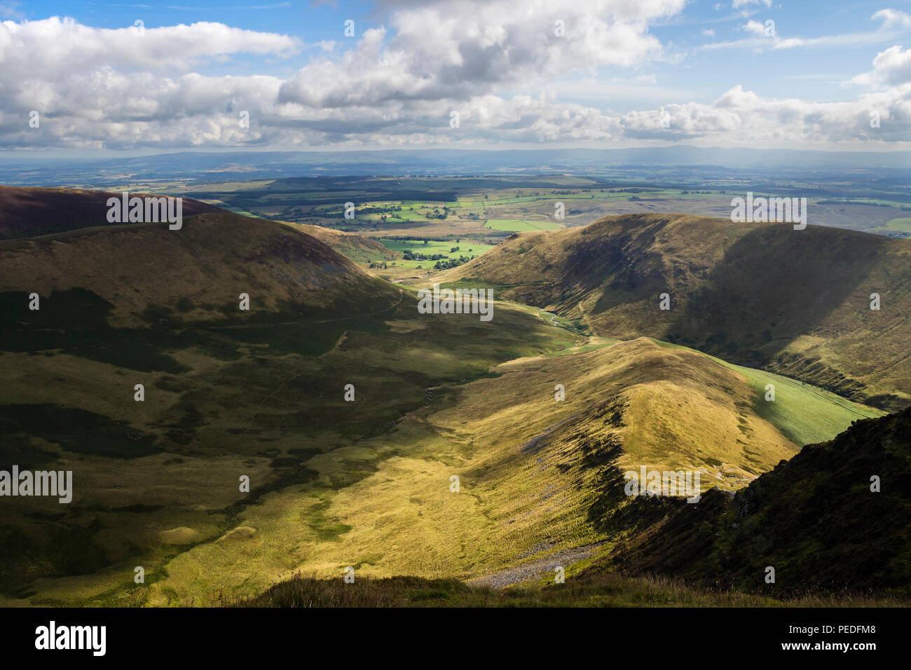 The View East From the Summit of Bannerdale Crags Over the East Ridge Towards the Pennines, Lake District, Cumbria, UK Stock Photo