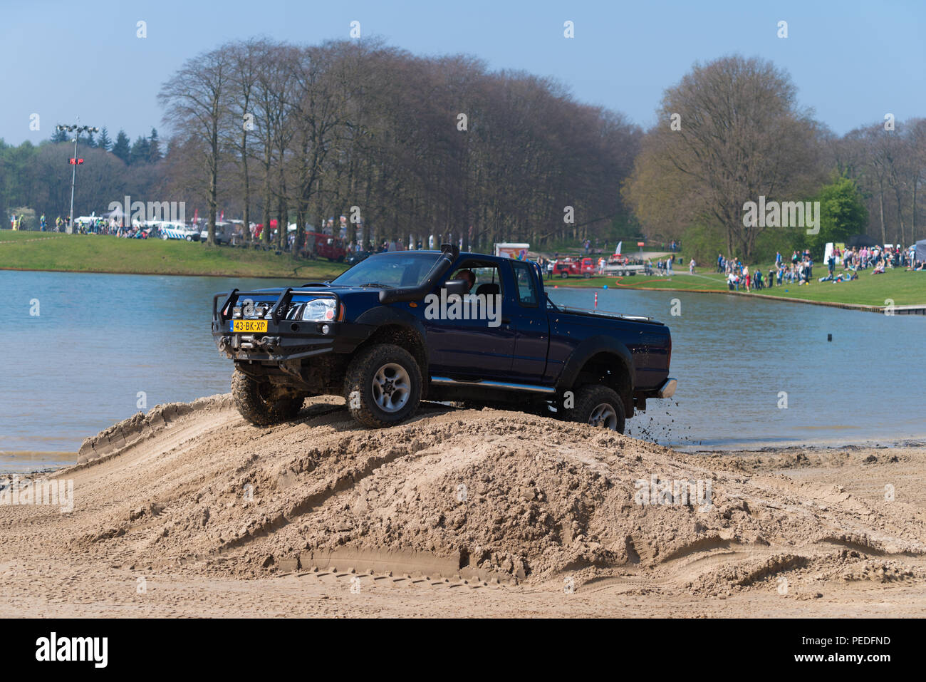 OLDENZAAL NETHERLANDS - APRIL 9, 2017: People having fun in an offroad car during an annual event Stock Photo