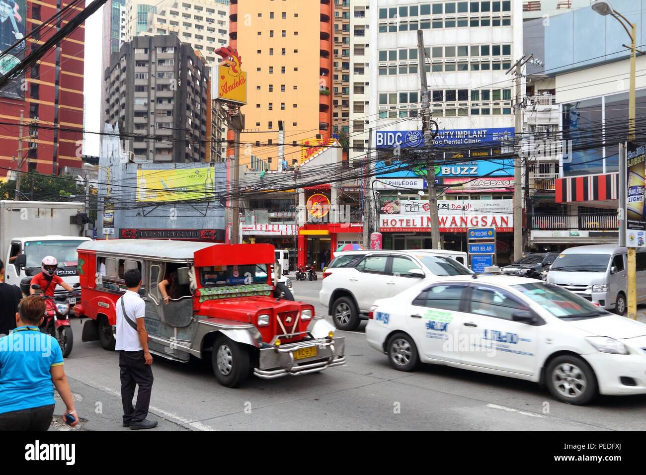 MANILA, PHILIPPINES - DECEMBER 7, 2017: People drive in heavy traffic in Makati City, Metro Manila, Philippines. Metro Manila is one of the biggest ur Stock Photo