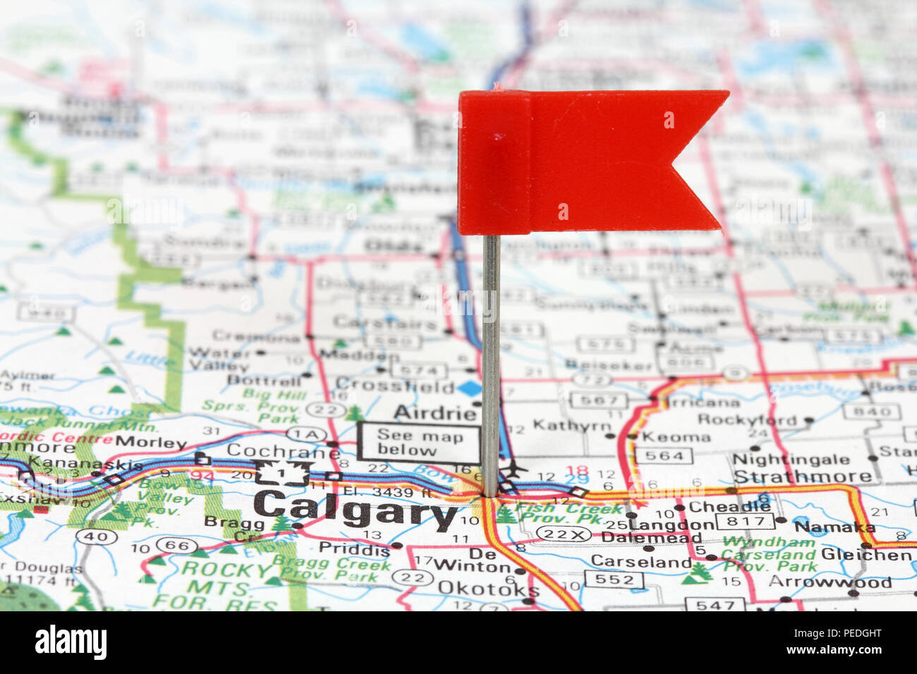 Calgary in Alberta, Canada. Red flag pin on an old map showing travel