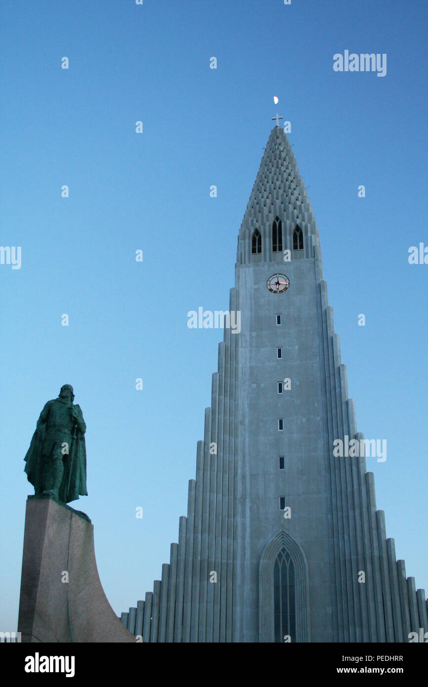 Hallgrimskirkja Church at night in winter with moon above cross, Reykjavik, Iceland Stock Photo