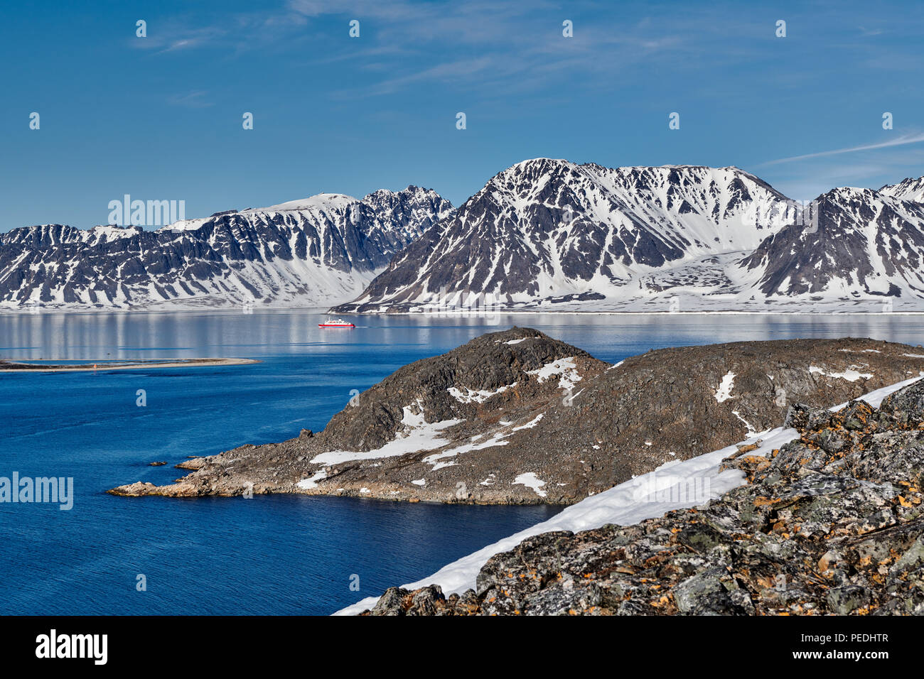 cruise ship crosses arctic landscape seen from Virgohamna, Svalbard or Spitsbergen, Europe Stock Photo