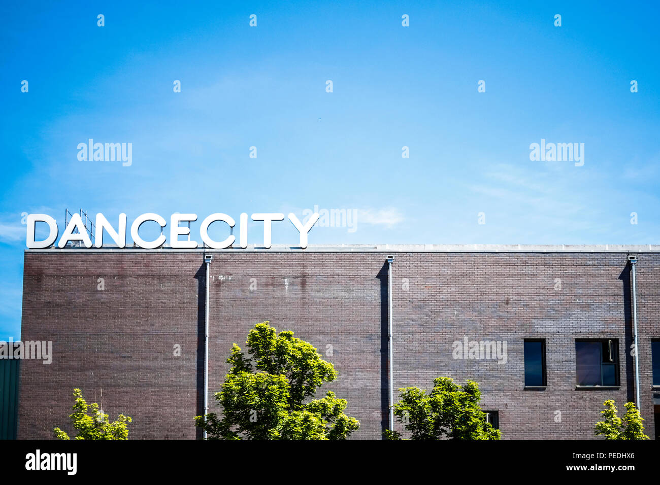 Sign on top of the Dance City building on St James Boulevard, Newcastle upon Tyne, UK Stock
