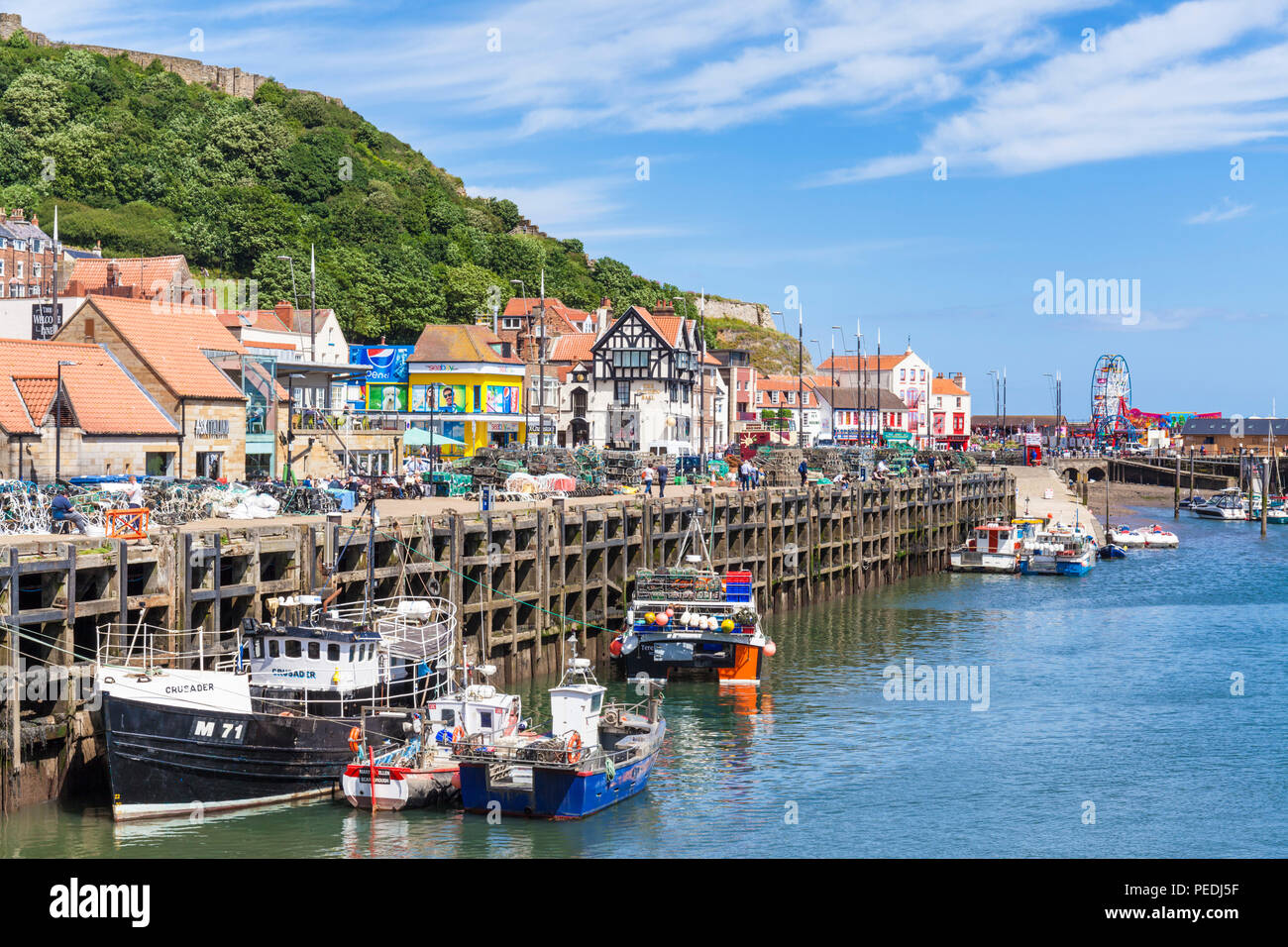 Scarborough Harbour with fishing boats and marina in south bay Scarborough UK Yorkshire north yorkshire scarborough england uk gb europe Stock Photo