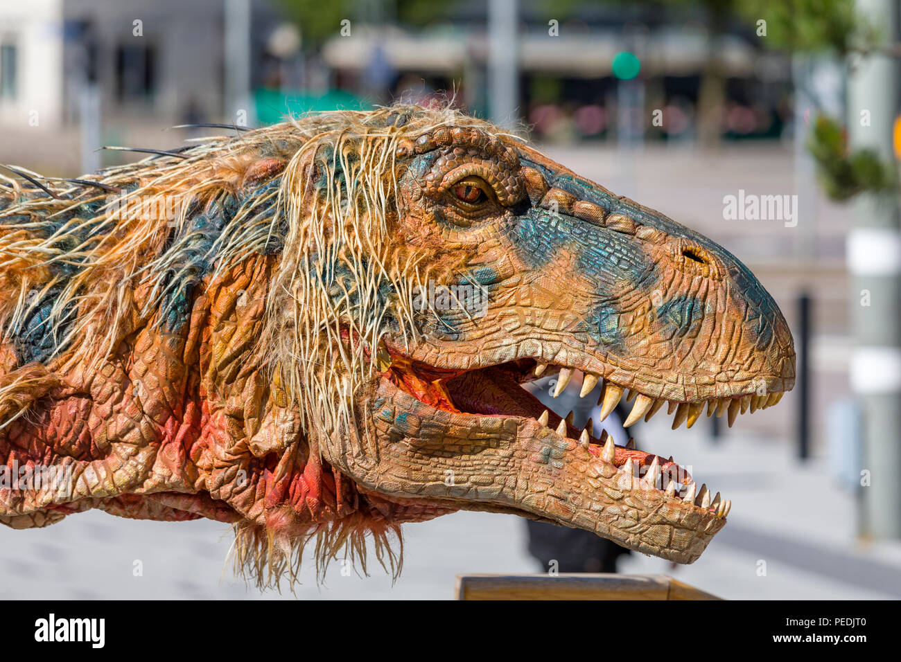 Life size creature from Walking with Dinosaurs - the $20 million arena spectacular walking around the streets of Gothenburg Stock Photo