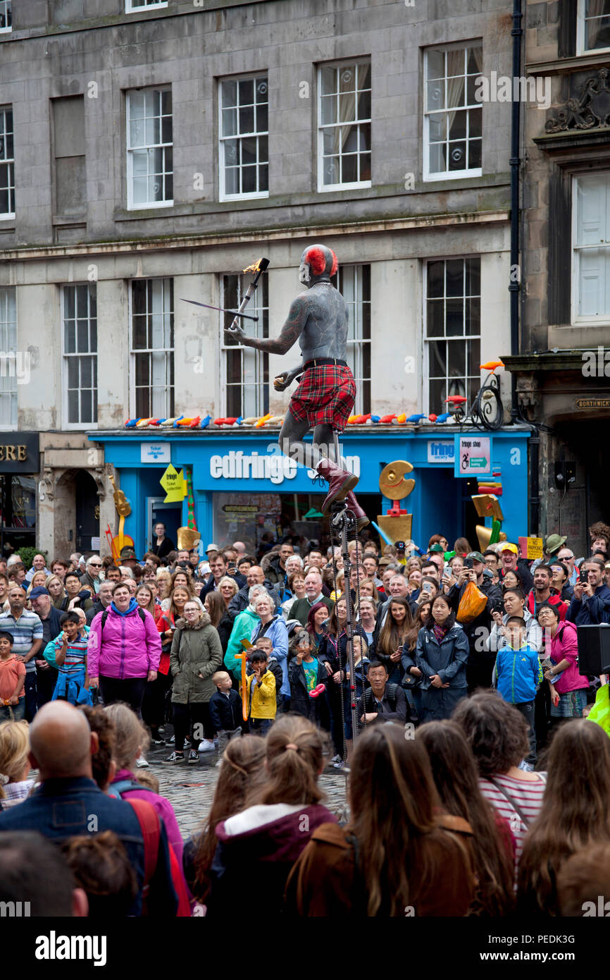 Edinburgh Fringe Festival 2018, performer with tattoos juggles fire torch Edinburgh, Scotland, UK Stock Photo