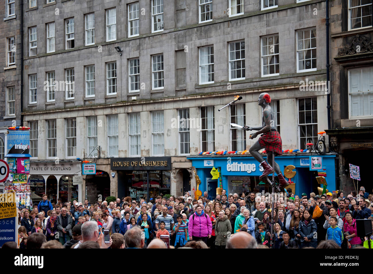 Edinburgh Fringe Festival 2018, performer with tattoos juggles fire torch Edinburgh, Scotland, UK Stock Photo