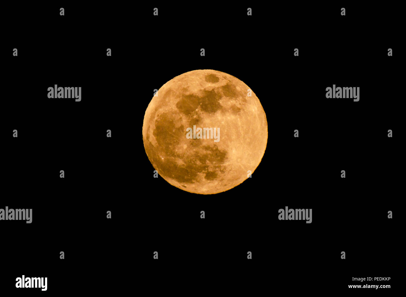 The yellow full moon on black background Stock Photo