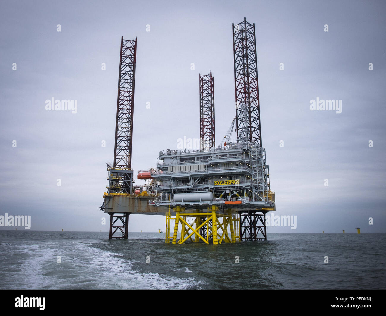 The Atlantic Amsterdam jacked up next to the first Race Bank Offshore Wind Farm (ROW01-Z02) substation. Stock Photo