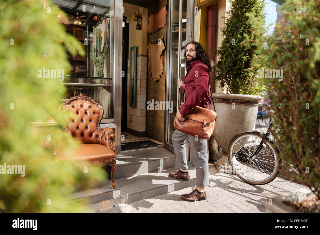 Nice handsome man holding his bag Stock Photo