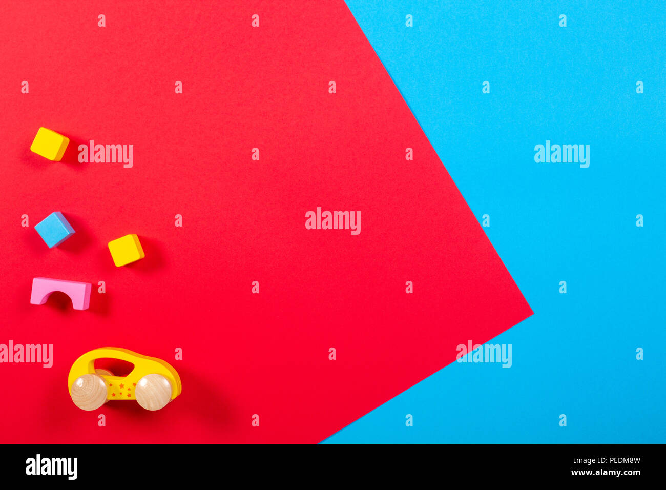 Toy car and wooden blocks on colorful background Stock Photo - Alamy