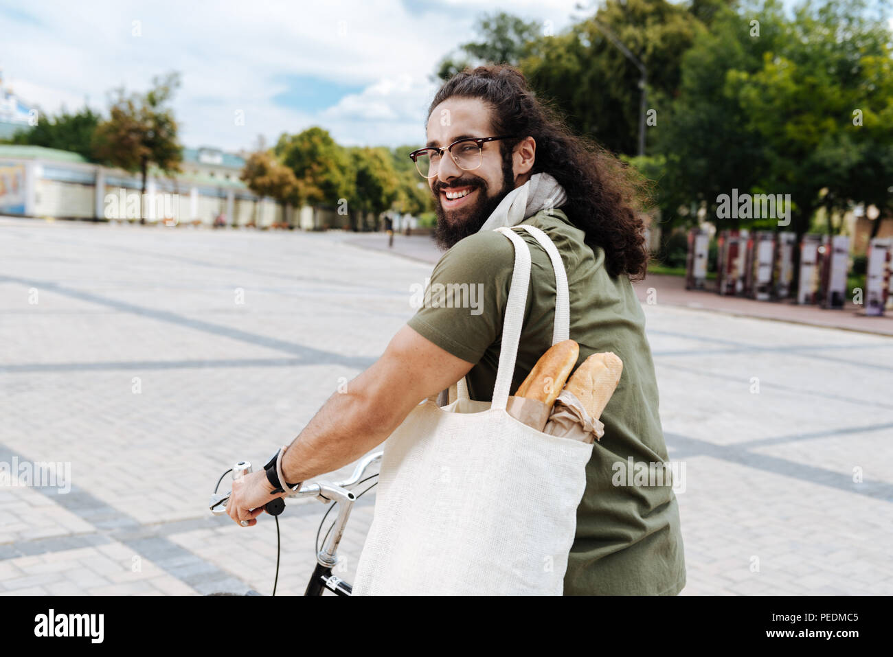 Delighted joyful man smiling to you Stock Photo