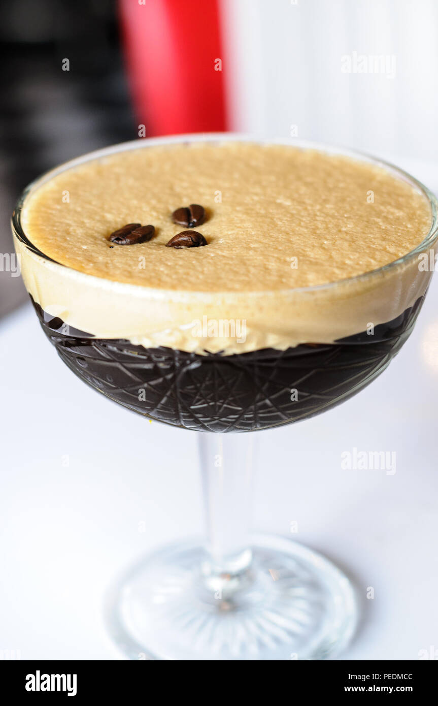 An espresso Martini cocktail with three coffee beans Stock Photo Alamy