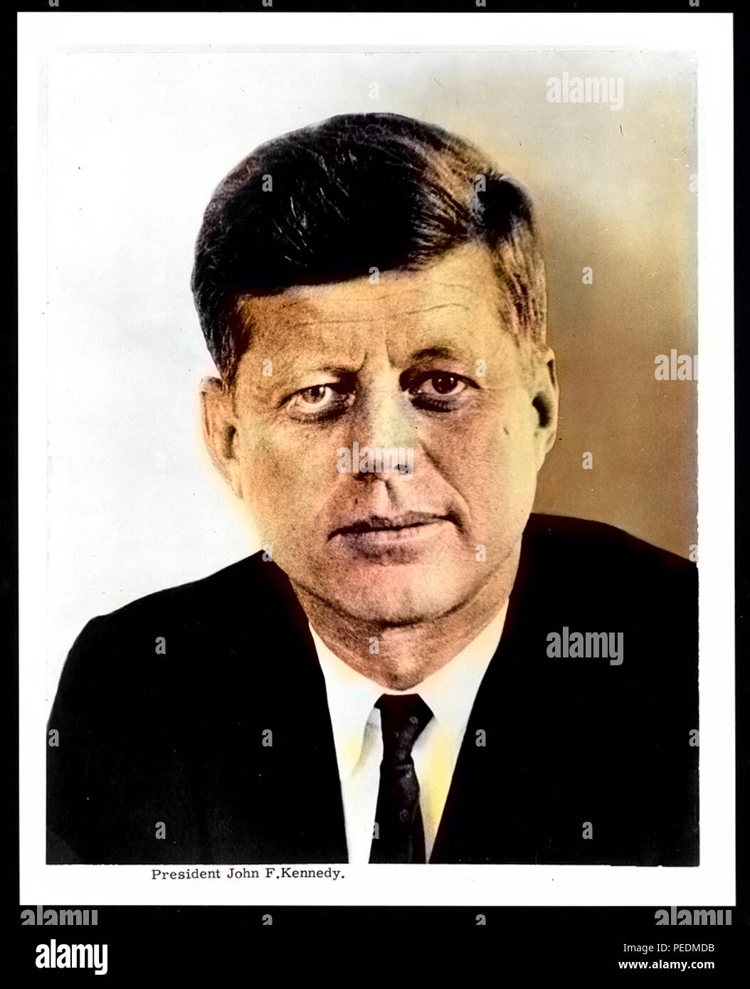 Colorized portrait of United States President John F Kennedy, half length, wearing a suit, with a neutral expression, 1962. Note: Image has been digitally colorized using a modern process. Colors may not be period-accurate. () Stock Photo