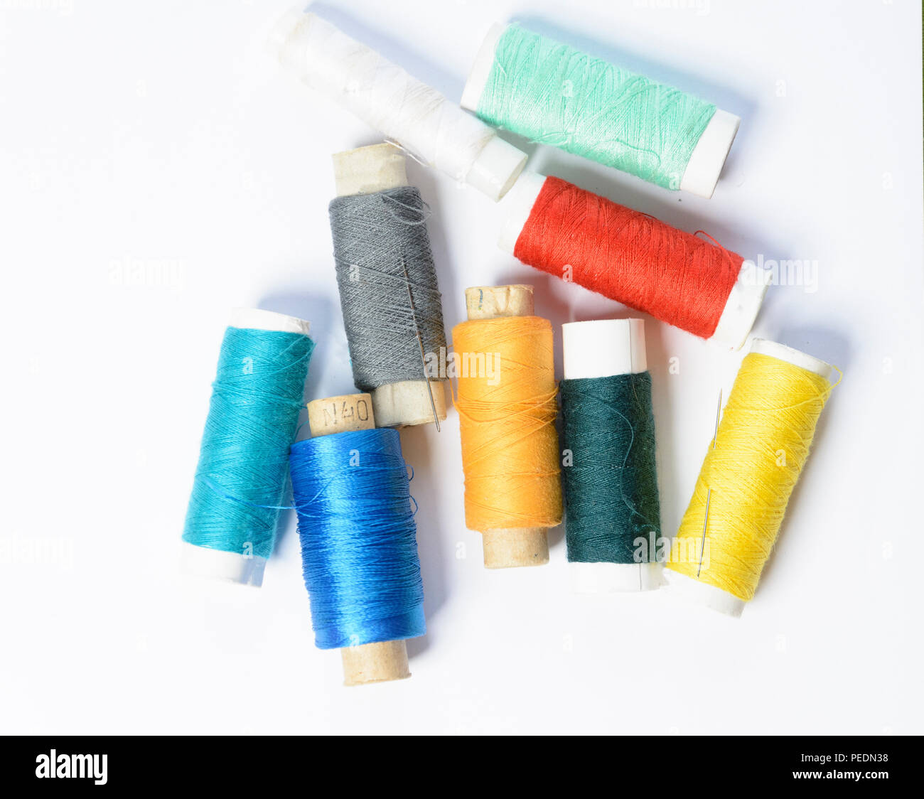 color threads for sewing on a white textured background 2018 Stock Photo