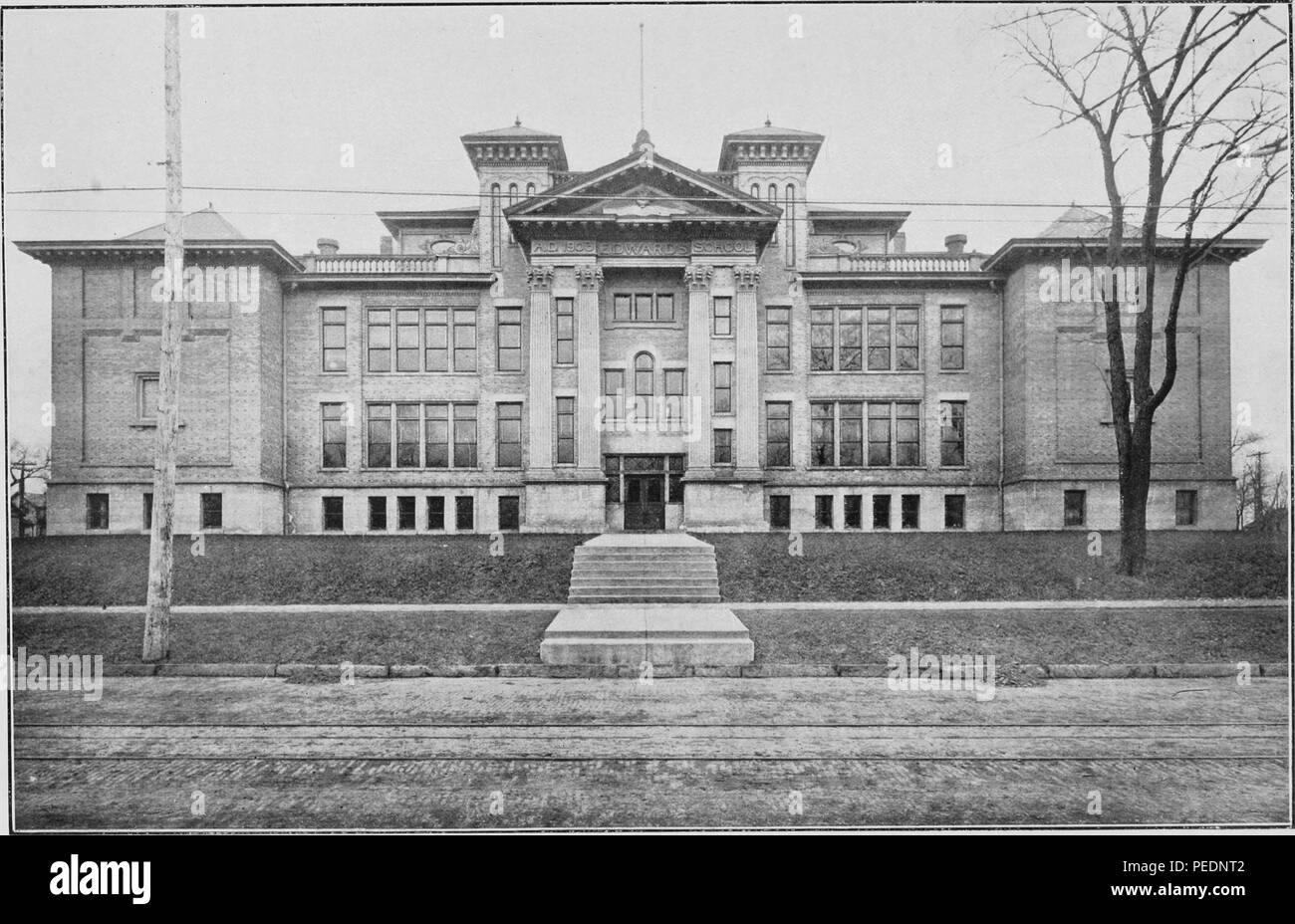 Black and white print depicting a view of the front facade of the