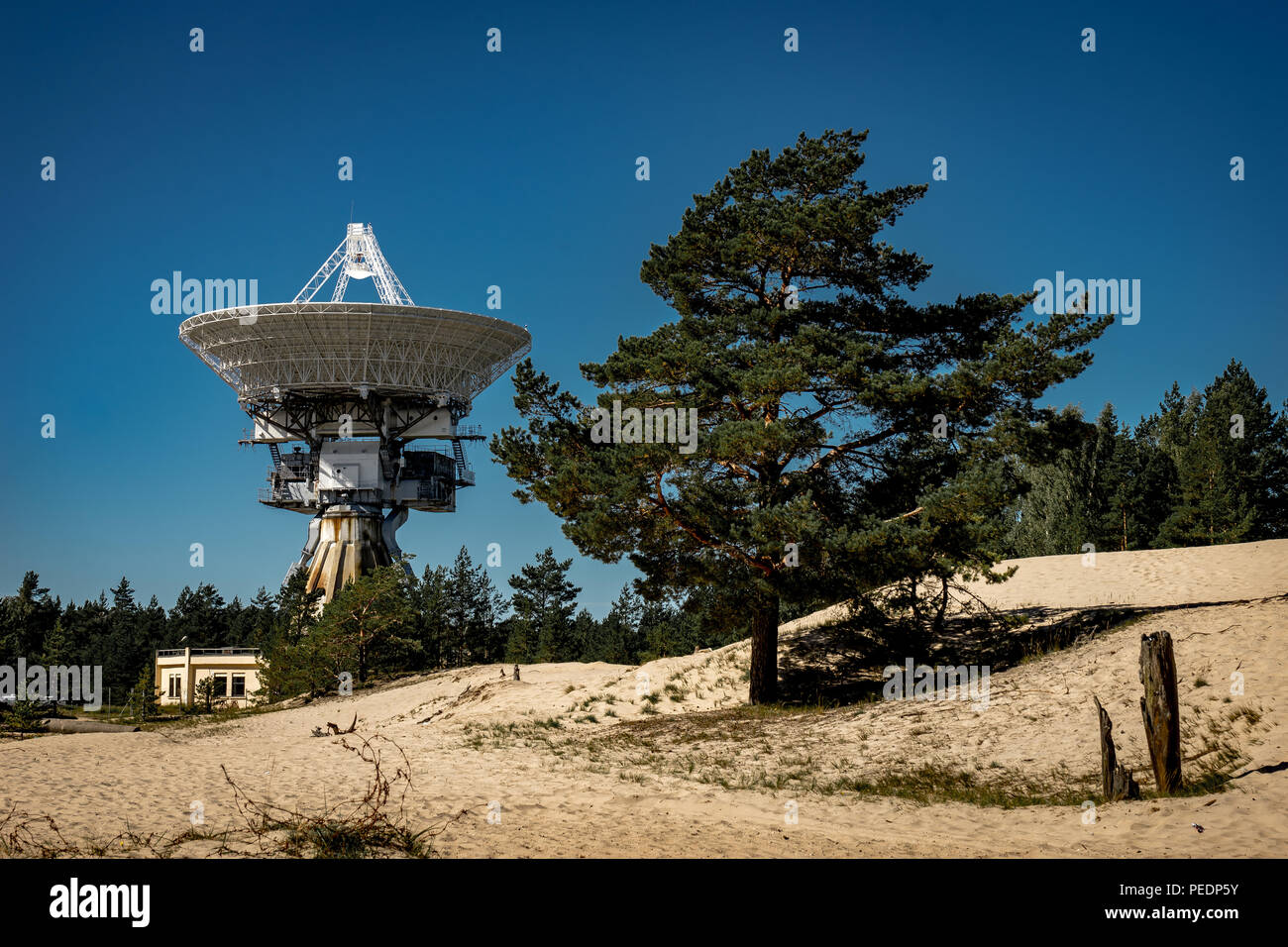 A huge soviet radio telescope near abandoned military town Irbene in Latvia. Former super-secret Soviet Army space spying object.Now largest radio tel Stock Photo
