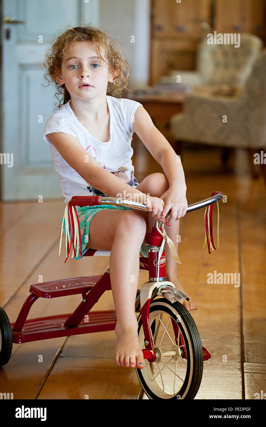 Young girl on tricycle Stock Photo Alamy