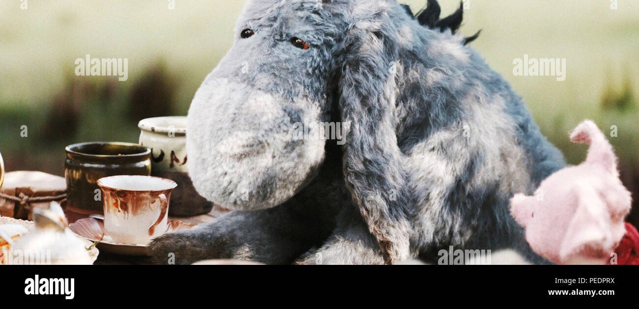 CHRISTOPHER ROBIN, lr Eeyore (voice Brad Garrett), Piglet (voice