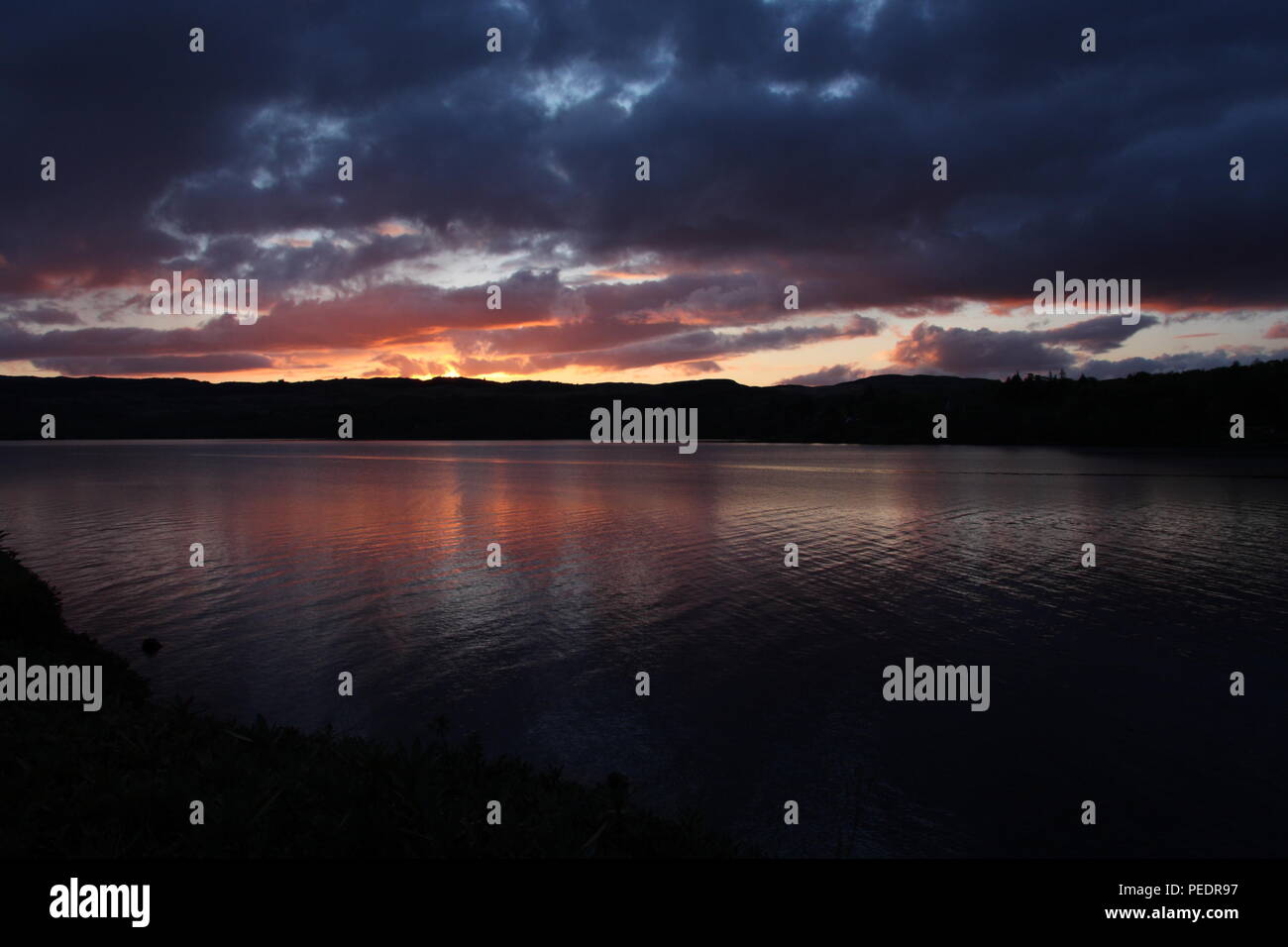 View across Loch Awe from Portsonachan Hotel as the sun sets in the evening across this Scottish Loch, in May Stock Photo