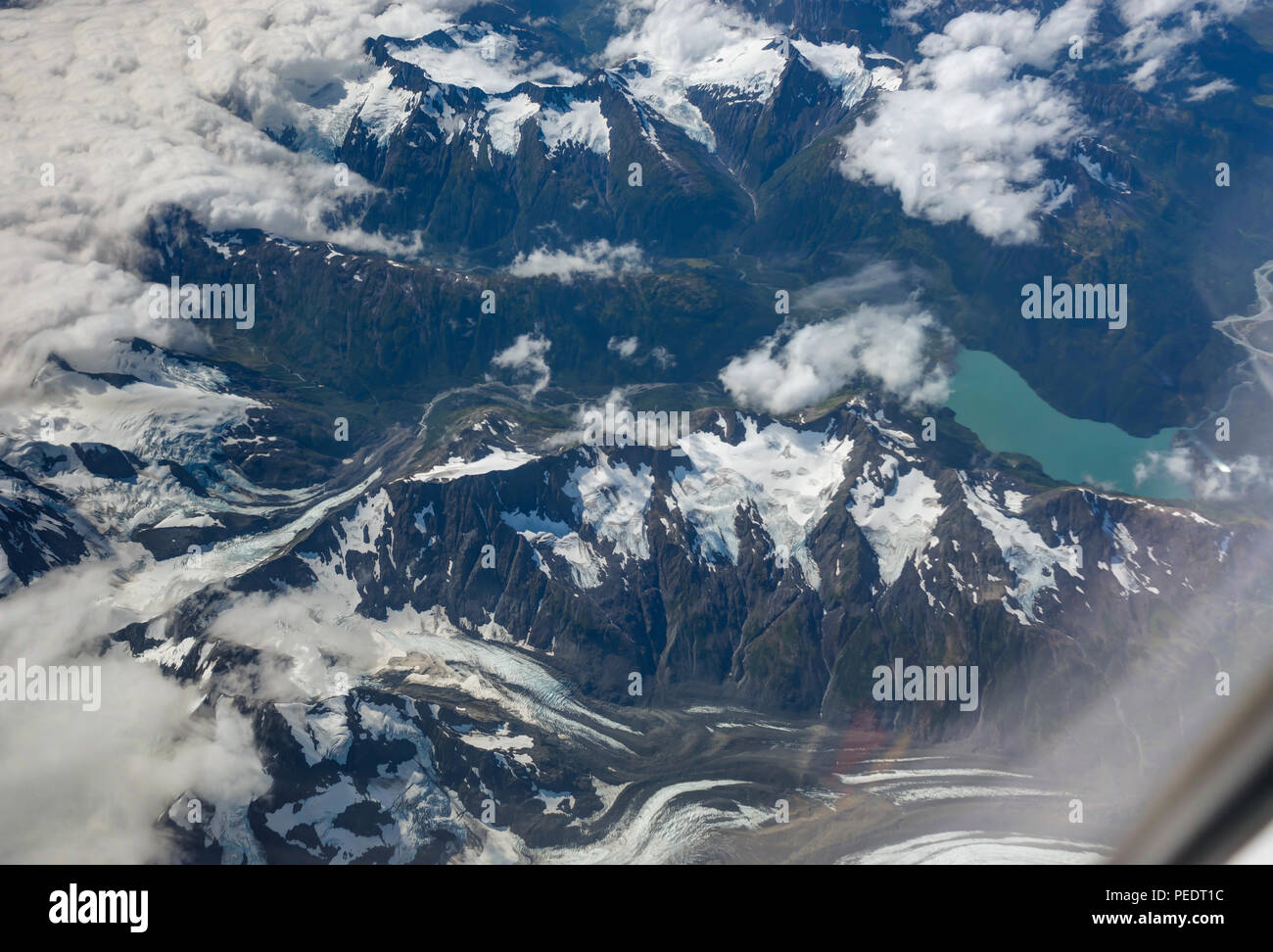 Aerial glacier view on the flight from Anchorage to Seattle. Photo taken in United States of America. Stock Photo