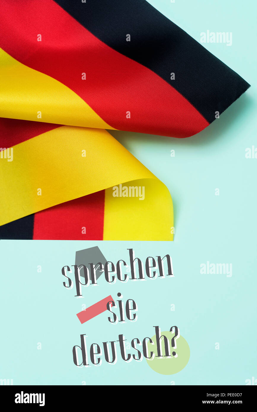 some flags of Germany and the question sprechen sie deutsch? do you speak German? written in